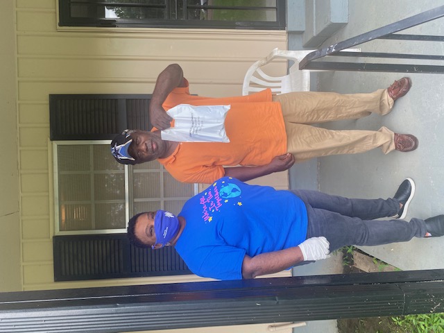 Worker delivering a care package to a man