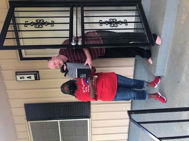 Man and woman posing for a photo with gift