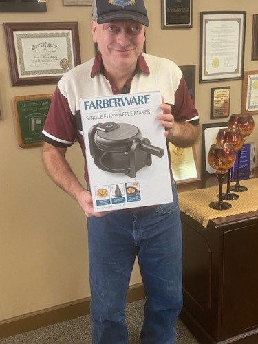 Man with a waffle maker won from the raffle