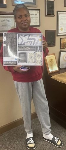 Woman with a bathroom gift set won from the raffle