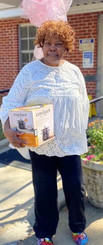 Woman with a new crockpot won from the raffle