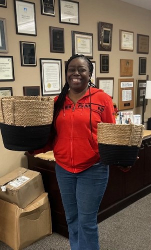 Woman with new baskets won from the raffle