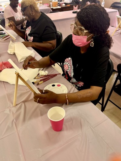 Residents painting on canvas